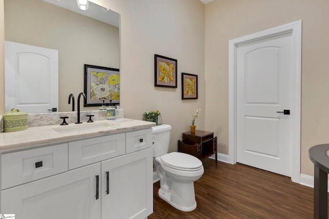 9 Graywood Ct, Simpsonville, SC 29680 - bathroom with toilet, wood finished floors, baseboards, and vanity