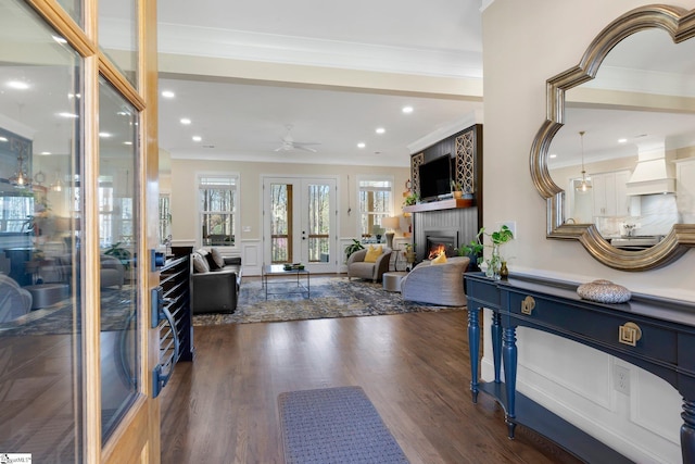 9 Graywood Ct, Simpsonville, SC 29680 - living area featuring dark wood-style floors, a fireplace, ceiling fan, and crown molding