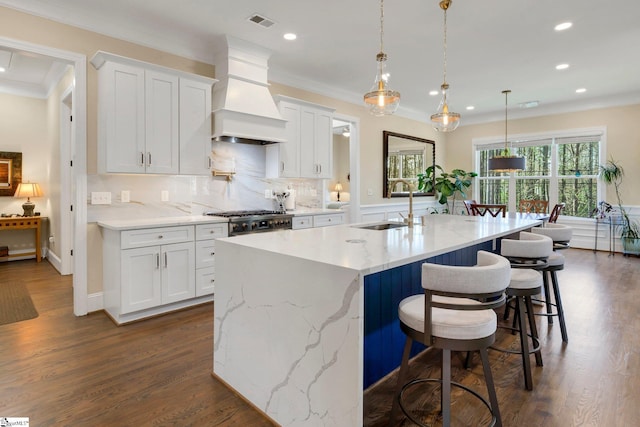 9 Graywood Ct, Simpsonville, SC 29680 - kitchen with a sink, tasteful backsplash, premium range hood, stovetop, and visible vents