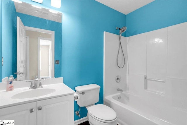 full bath with toilet, vanity, and shower / washtub combination