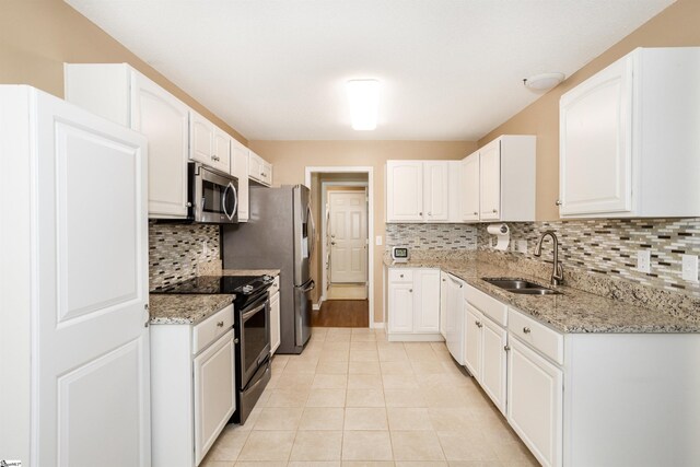 213 Lexington Place Way, Greenville, SC 29615 - kitchen with a sink, white cabinetry, light stone countertops, and appliances with stainless steel finishes
