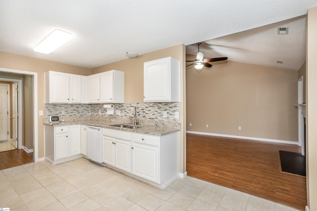 213 Lexington Place Way, Greenville, SC 29615 - kitchen with backsplash, a sink, ceiling fan, light stone countertops, and white dishwasher