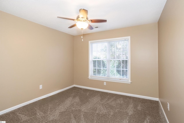 213 Lexington Place Way, Greenville, SC 29615 - unfurnished room featuring baseboards, dark colored carpet, and ceiling fan