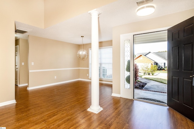 213 Lexington Place Way, Greenville, SC 29615 - foyer entrance featuring ornate columns, baseboards, visible vents, and wood finished floors