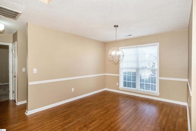 213 Lexington Place Way, Greenville, SC 29615 - empty room featuring an inviting chandelier, dark wood-type flooring, baseboards, a textured ceiling, and visible vents