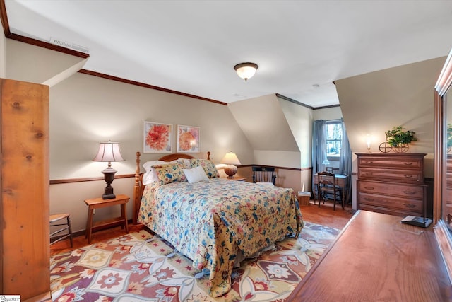 202 Mornington Ct, Simpsonville, SC 29681 - bedroom with crown molding, wood finished floors, lofted ceiling, baseboards, and visible vents