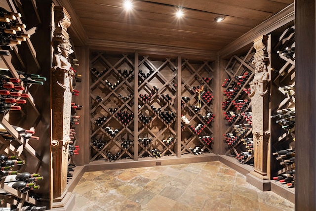 wine room with wooden ceiling and stone finish flooring