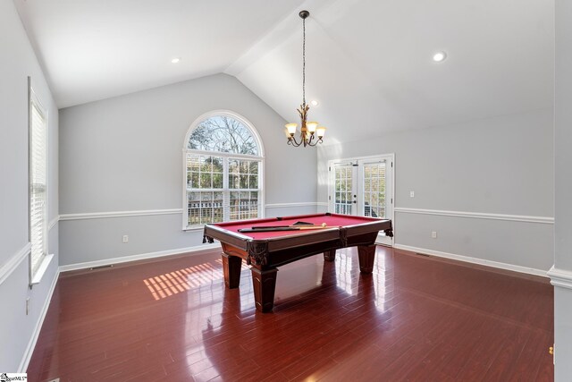 recreation room featuring vaulted ceiling, wood finished floors, and a healthy amount of sunlight