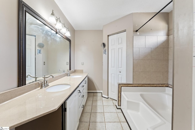 full bathroom featuring double vanity, a sink, tile patterned floors, and a washtub