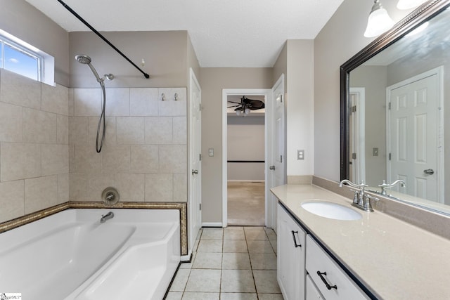 bathroom with a textured ceiling, ceiling fan, tile patterned floors, vanity, and shower / bathtub combination