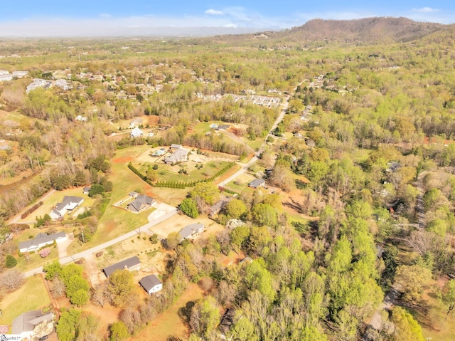 birds eye view of property featuring a view of trees
