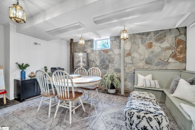 dining space featuring visible vents