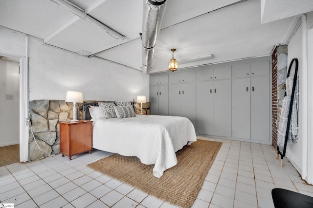 bedroom with light tile patterned floors