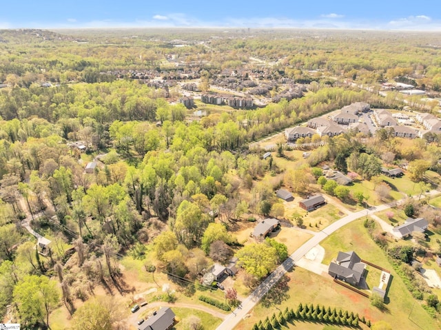 drone / aerial view featuring a view of trees