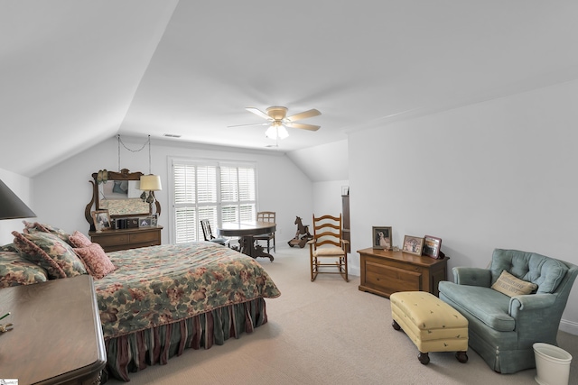 bedroom with lofted ceiling, visible vents, carpet floors, and a ceiling fan