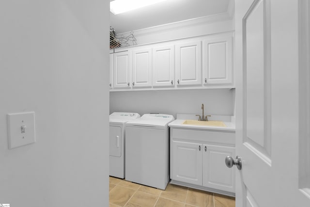 laundry room with a sink, cabinet space, and washing machine and dryer