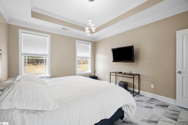 bedroom with marble finish floor, a tray ceiling, multiple windows, and baseboards