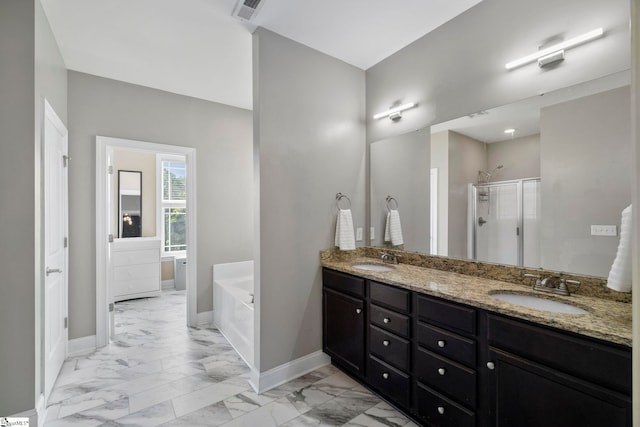 full bath featuring marble finish floor, visible vents, and a sink