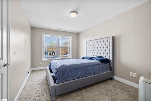 bedroom with baseboards, visible vents, and carpet floors