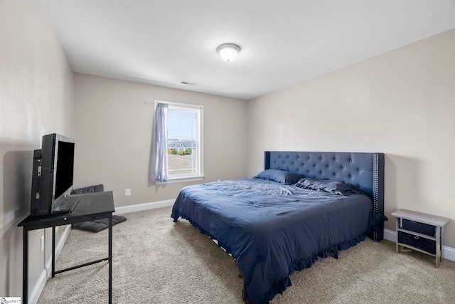 carpeted bedroom with baseboards and visible vents