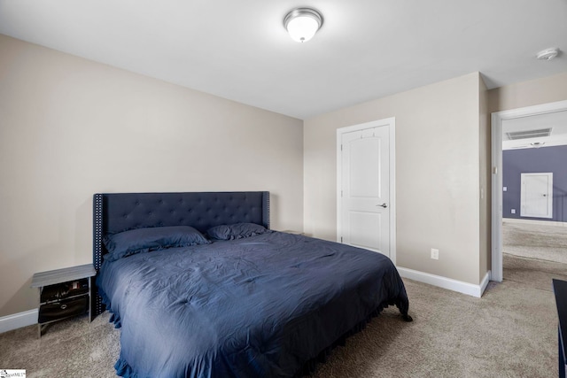 carpeted bedroom with baseboards and visible vents