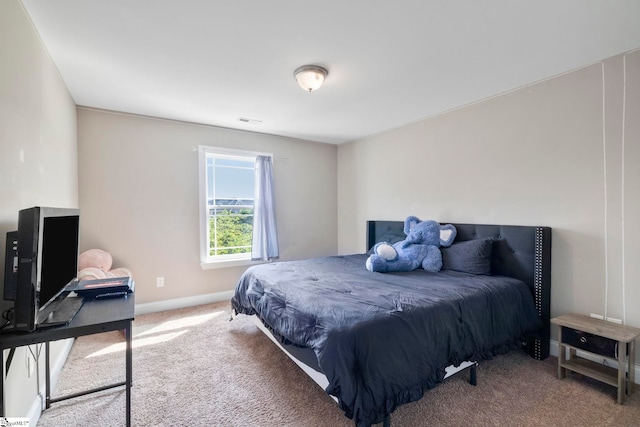 bedroom featuring carpet floors, baseboards, and visible vents