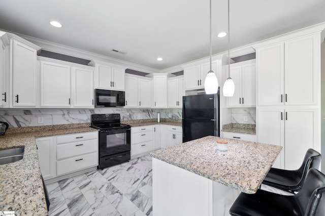 kitchen featuring light stone counters, marble finish floor, black appliances, decorative backsplash, and ornamental molding