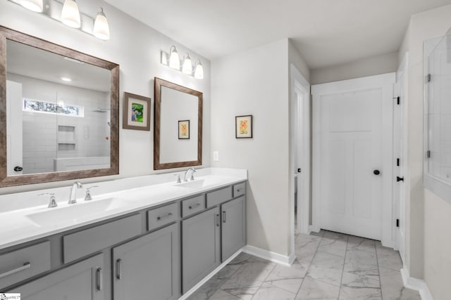 120 Marshfield Trl, Simpsonville, SC 29680 - full bath featuring marble finish flooring, double vanity, baseboards, and tiled shower