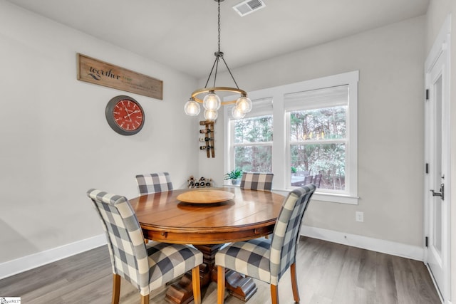 120 Marshfield Trl, Simpsonville, SC 29680 - dining space featuring wood finished floors, baseboards, and a chandelier