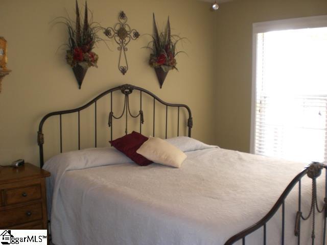 bedroom featuring multiple windows