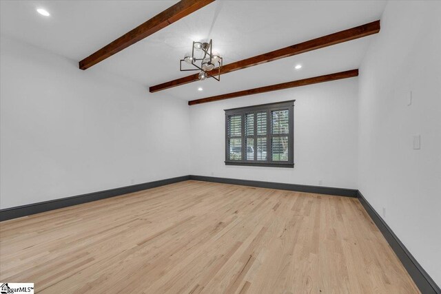 empty room featuring a chandelier, wood finished floors, baseboards, beamed ceiling, and recessed lighting