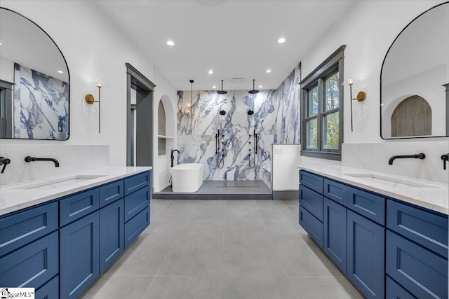 bathroom with decorative backsplash, a sink, and walk in shower