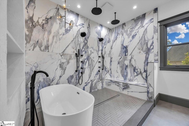 bathroom with a soaking tub, recessed lighting, tile walls, and a marble finish shower