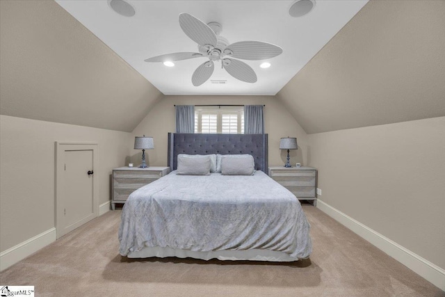 carpeted bedroom featuring baseboards, lofted ceiling, visible vents, and ceiling fan