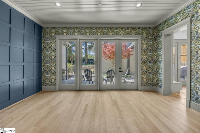 unfurnished sunroom featuring a healthy amount of sunlight and french doors