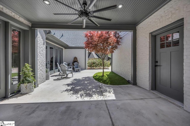 view of patio featuring ceiling fan and french doors