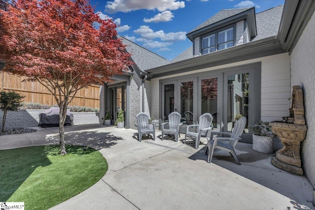 view of patio / terrace with fence and french doors