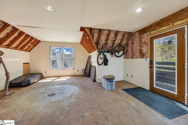 additional living space featuring lofted ceiling