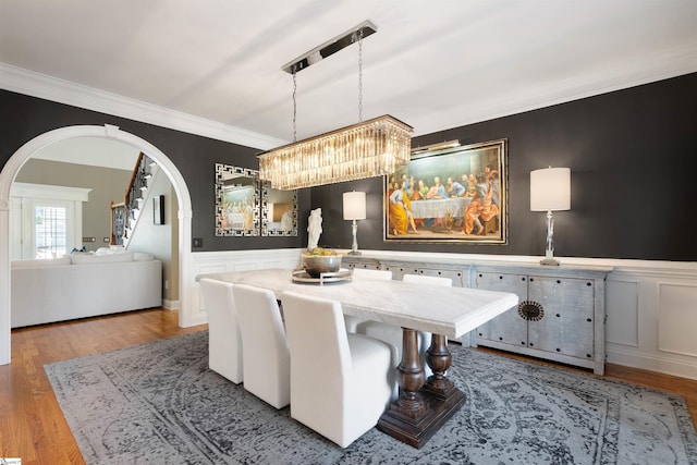 100 Breeds Hill Way, Greer, SC 29650 - dining space with wainscoting, arched walkways, and light wood-style floors