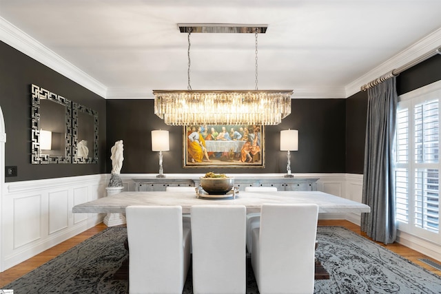 100 Breeds Hill Way, Greer, SC 29650 - dining space featuring an inviting chandelier, ornamental molding, a healthy amount of sunlight, and wainscoting