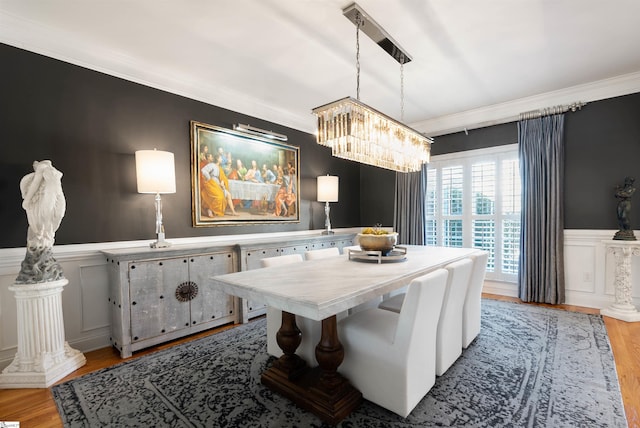 100 Breeds Hill Way, Greer, SC 29650 - dining room featuring a wainscoted wall, an inviting chandelier, light wood-style floors, and crown molding