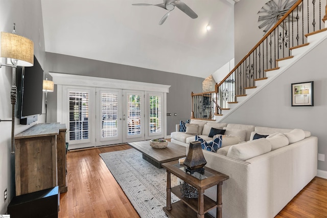 100 Breeds Hill Way, Greer, SC 29650 - living area featuring a ceiling fan, high vaulted ceiling, stairway, and light wood-style flooring