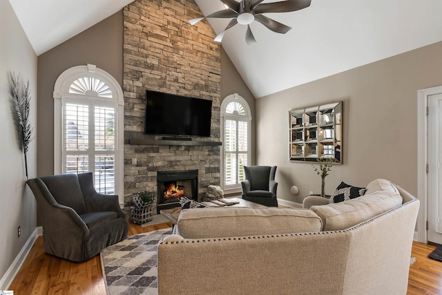 100 Breeds Hill Way, Greer, SC 29650 - living room with wood finished floors, a stone fireplace, baseboards, and ceiling fan
