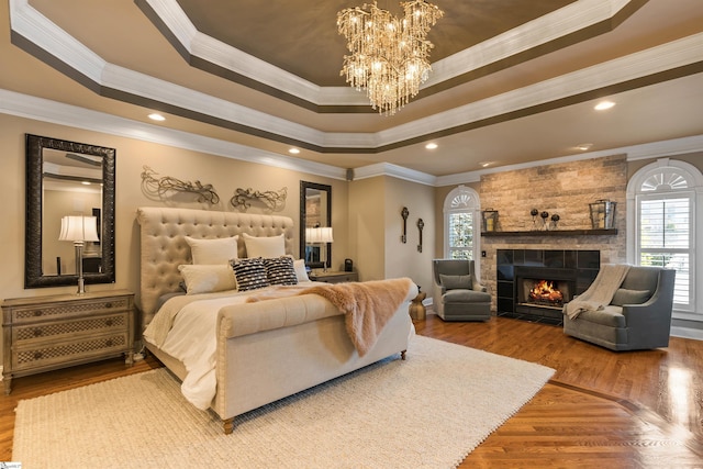 100 Breeds Hill Way, Greer, SC 29650 - bedroom featuring a raised ceiling, multiple windows, a chandelier, and wood finished floors