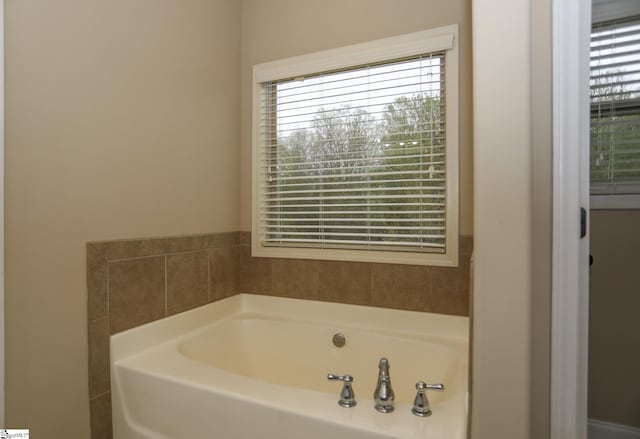 full bath with a garden tub
