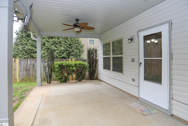 view of patio / terrace with a ceiling fan and fence