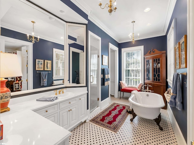 full bathroom featuring vanity, an inviting chandelier, ornamental molding, a stall shower, and a freestanding bath