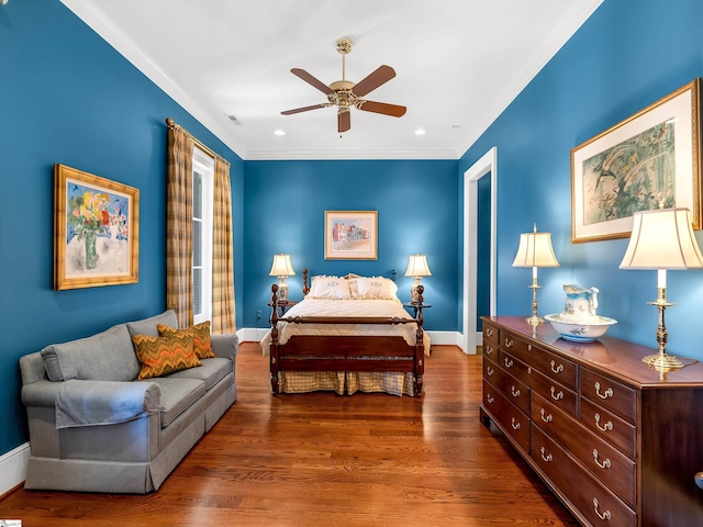 bedroom with crown molding, recessed lighting, baseboards, visible vents, and wood finished floors