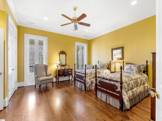 bedroom featuring visible vents, wood finished floors, recessed lighting, and crown molding