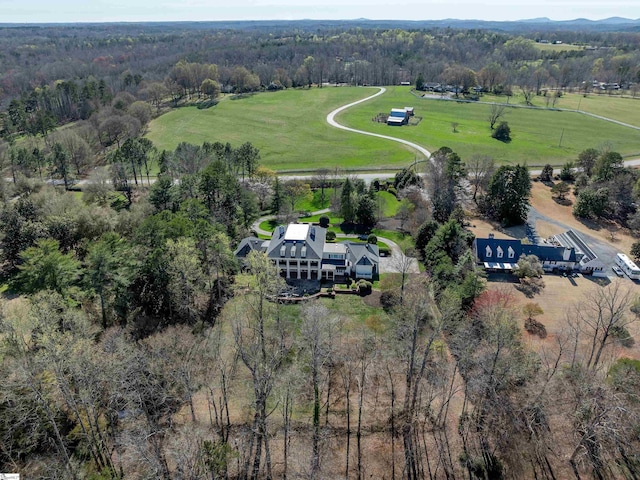 bird's eye view with a forest view and a rural view